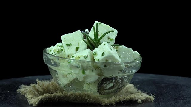Portion of rotating Feta Cheese (not loopable 4K footage)
