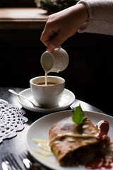 coffee cup and cake on wooden table