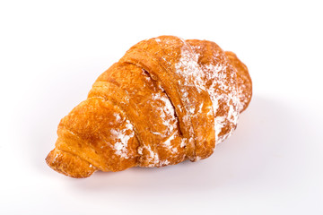 pile of fresh and delicious kroissants and rolls on a white back