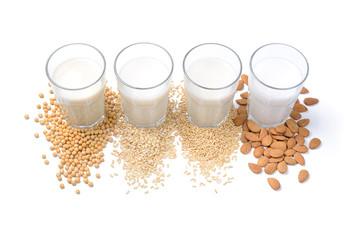 Vegetable milk: soy milk, rice milk, oat milk and almond milk isolated on white background.