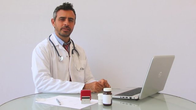 Disapointed doctor noding his fingure