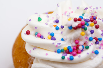 close-up of a cupcake decorated with sprinkles.