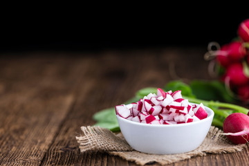 Diced Radishes on wooden background