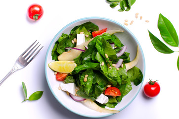 Healthy spinach salad with a top with a cocktail. Authentic fresh salad. Vegetable salad.