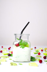 handmade yogurt with oranges on a white background