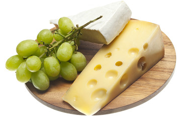 bunch of grapes with cheese on wood board