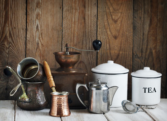 Kitchen still life.  Vintage coffee grinder, coffee pot and tea