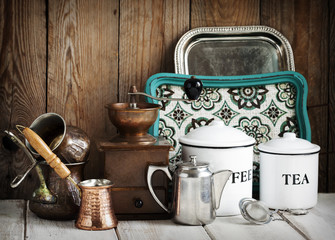 Kitchen still life.  Vintage coffee grinder, coffee pot and tea