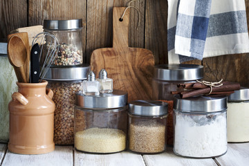 Arrangement of dry food products and kitchen utensils in the kitchen table