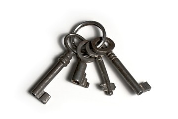 four old keys on keyringwith rust and dirt