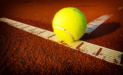 Tennis balls on a tennis clay court