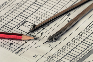 Construction drawings close-up. Tools for drawing reading, measurement and removal notes. Photos with limited depth of field.