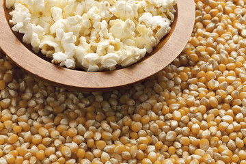 cropped image of pop corn in wooden bowl