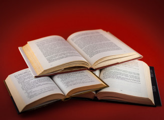 closeup of open books on colored background
