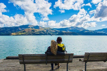 Young couple relaxing on a lake 