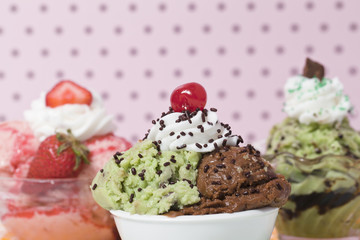 three bowls of assorted ice cream