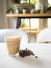 Cup of coffee on table in cafe
