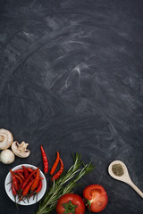 Restaurant black table with food ingredients and utensil