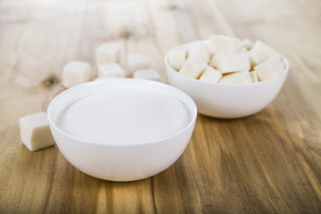Fototapeta na wymiar Sugar in a wooden bowls