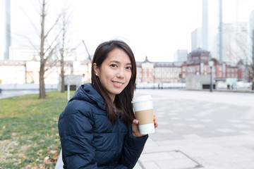 Woman drinking coffee at outdoor