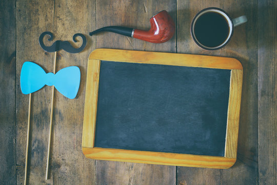 blank blackboard and composition of man's accessories