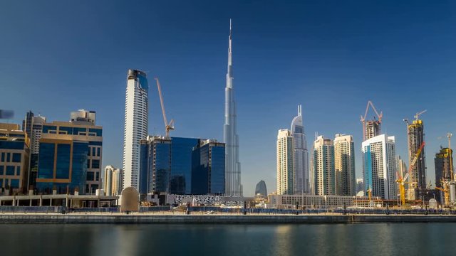 Scenic skyline of Dubai's business bay with skyscrapers at day time timelapse hyperlapse.
