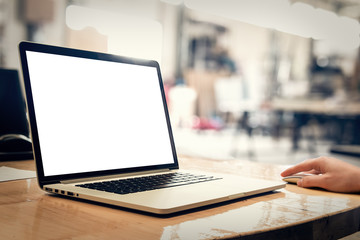 Laptop with blank screen on table - whole laptop is sharp.