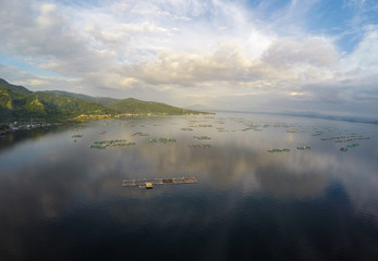 Obraz na płótnie Canvas Aerial view of fish farm in Taal Lake