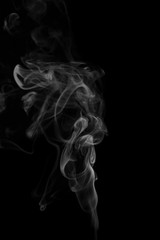 Abstract gray smoke from the incense sticks.