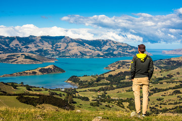 Men watching the Bay of Akaroa, New Zealand 