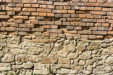 brick wall without plaster with crumbling bricks