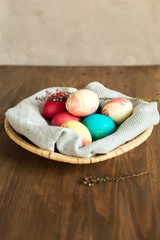 Obraz na płótnie Canvas Colored Easter eggs in basket