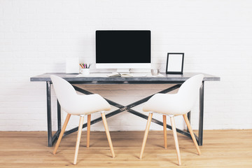 Two white chairs at desk
