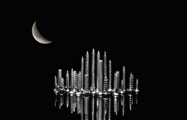 Various screws on end point upward to resemble a cityscape skyline.