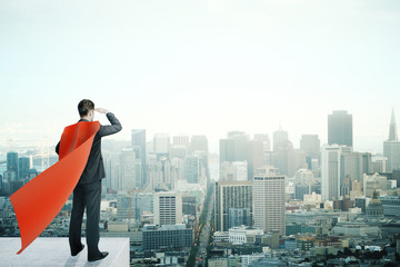 Businessman with red cape