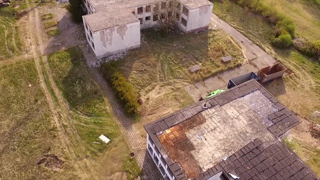 flight over ruin of a school - birdview