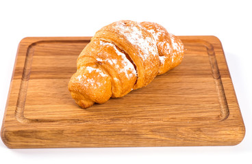 pile of fresh and delicious kroissants and rolls on a white back