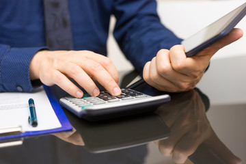 businessman is using tablet computer to get information from int