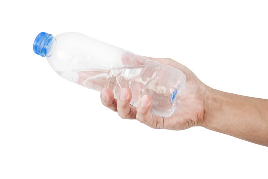 Hand holding, giving or receiving bottle of water, isolated on white background
