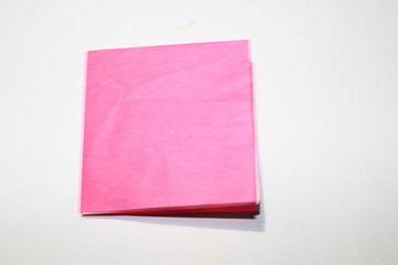 origami paper that is dull, sloppy, crumpled pink