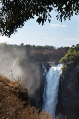 Victoria Falls in October with rainbow crossing