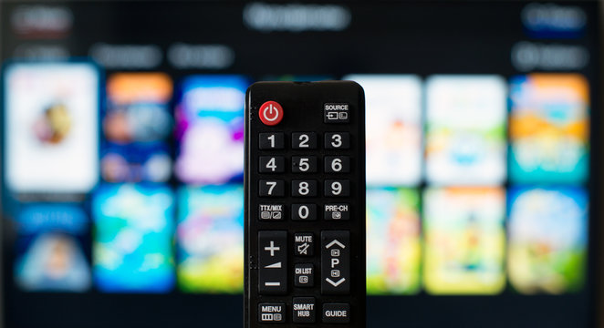 TV remote control against SmartTV operating system.