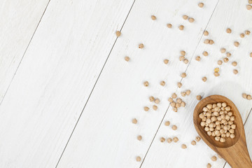 coriander in wooden spoon