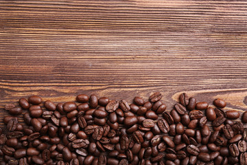 Coffee beans on wooden background