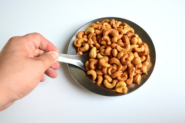 Roasted cashew nuts in spoon