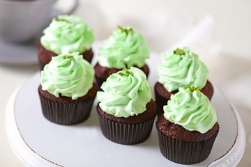 Beautiful chocolate cupcakes with mint cream