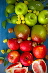Fruits on dark blue wooden background