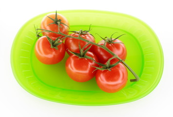 Tomatoes on green plate