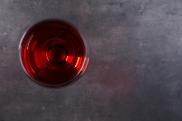 Glasses with red wines on grey table, copy space