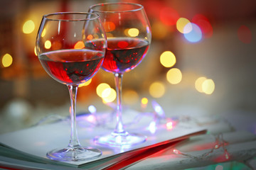 Two glasses of red wine on Christmas decoration background